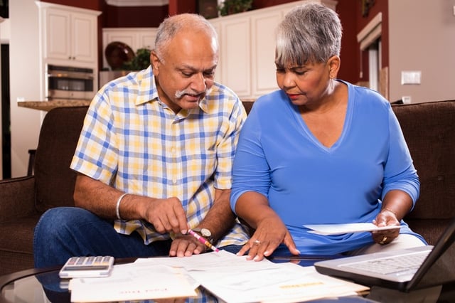 couple researching how to save money